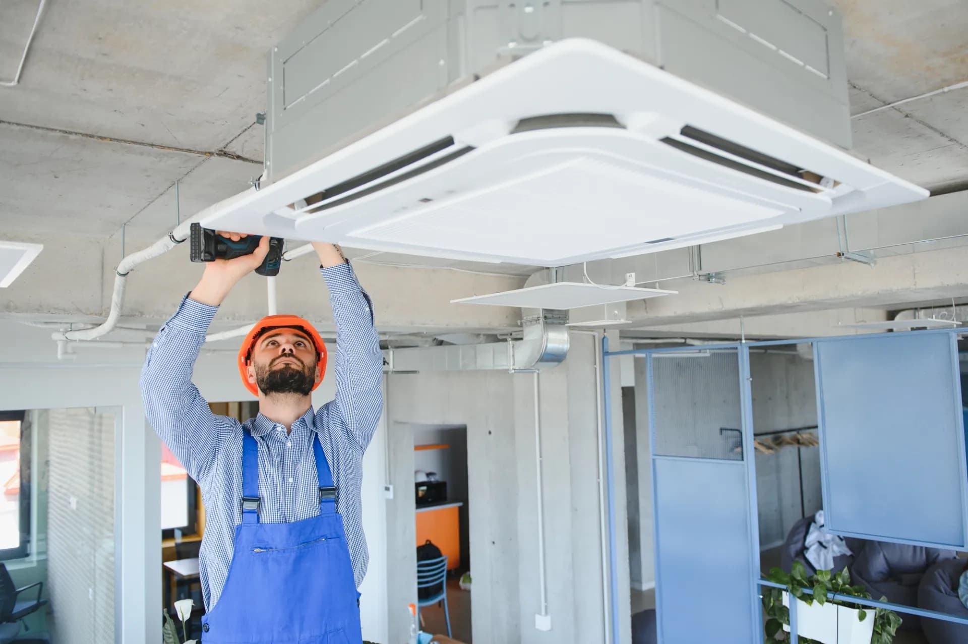 Technician servicing an air conditioning system